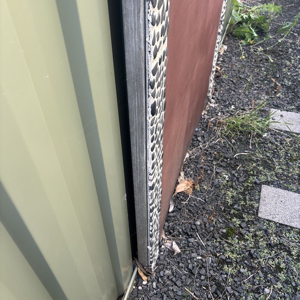 Untreated timber garden edging beside the house, an easy food source for termites, found during a building and pest inspection in Pakenham