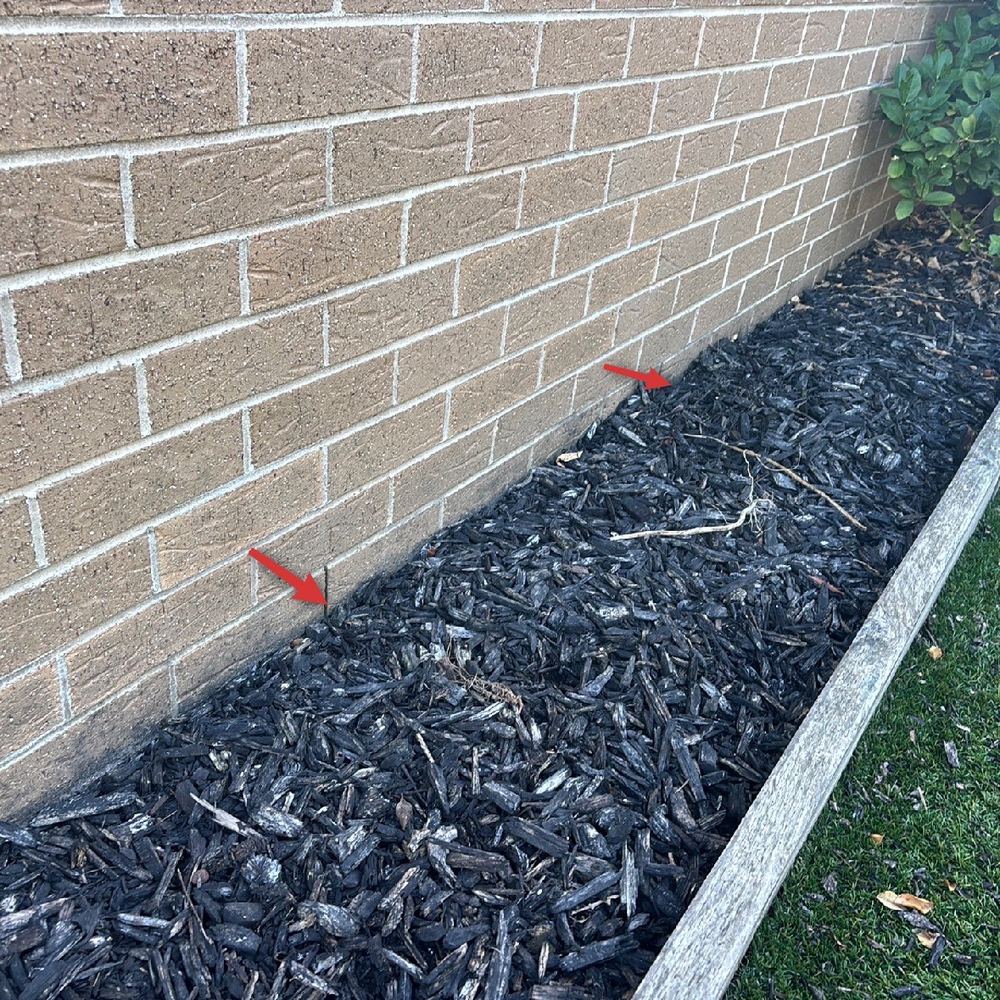 Mulch, garden edging and buried weep holes