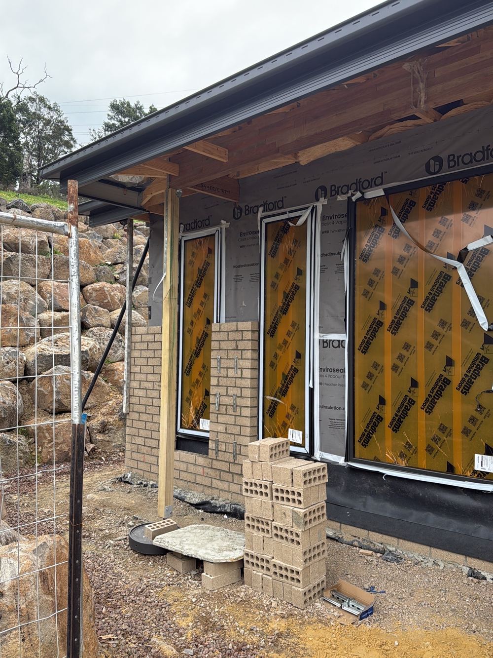 External cladding still incomplete at lock-up, leaving the frame exposed, found during a lock-up inspection in Pakenham