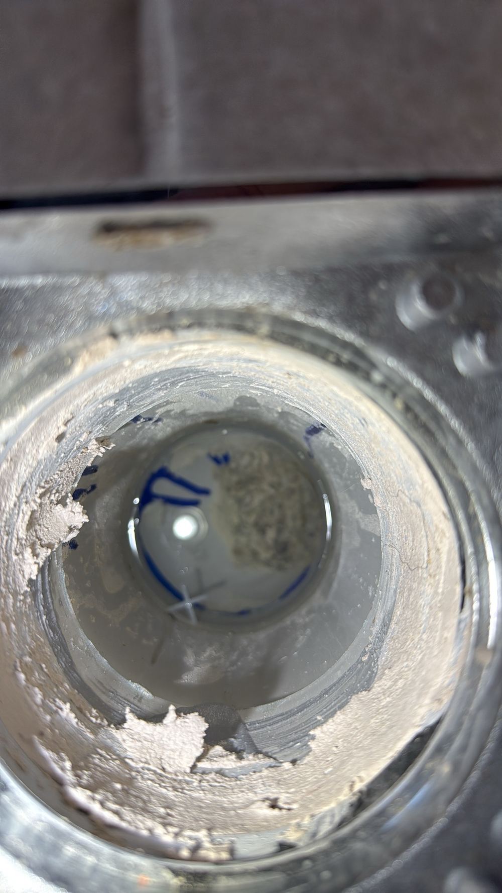 Construction debris sitting inside a drainage pipe, ready to cause a blockage, found during a pre-handover inspection in Pakenham