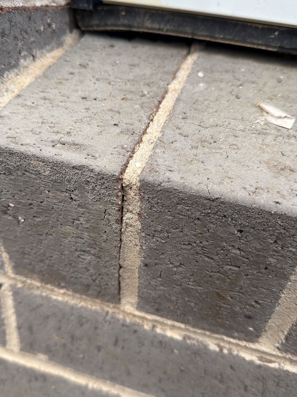 Rubber sill flashing cut short, leaving the window corner exposed to water, found during a pre-handover inspection in Pakenham