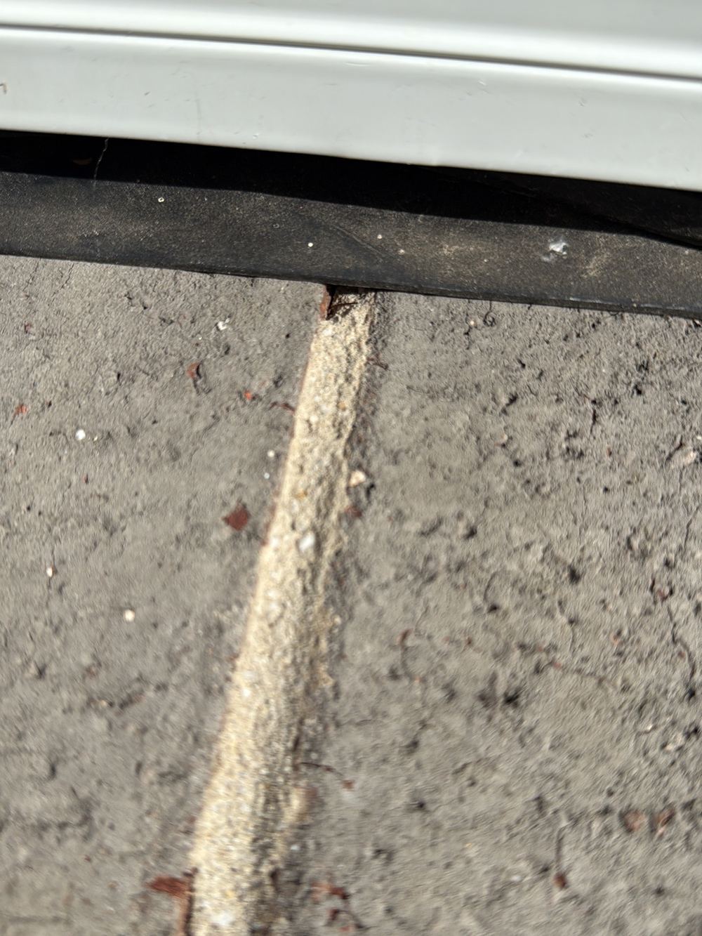 Unfilled joint under a window sill that lets water track into the wall, found during a pre-handover inspection in Pakenham