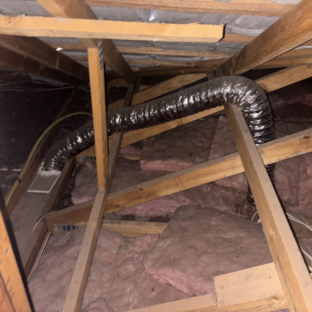 Plumbing vent stack ending inside the roof space instead of venting outside, found during a pre-purchase inspection in Pakenham