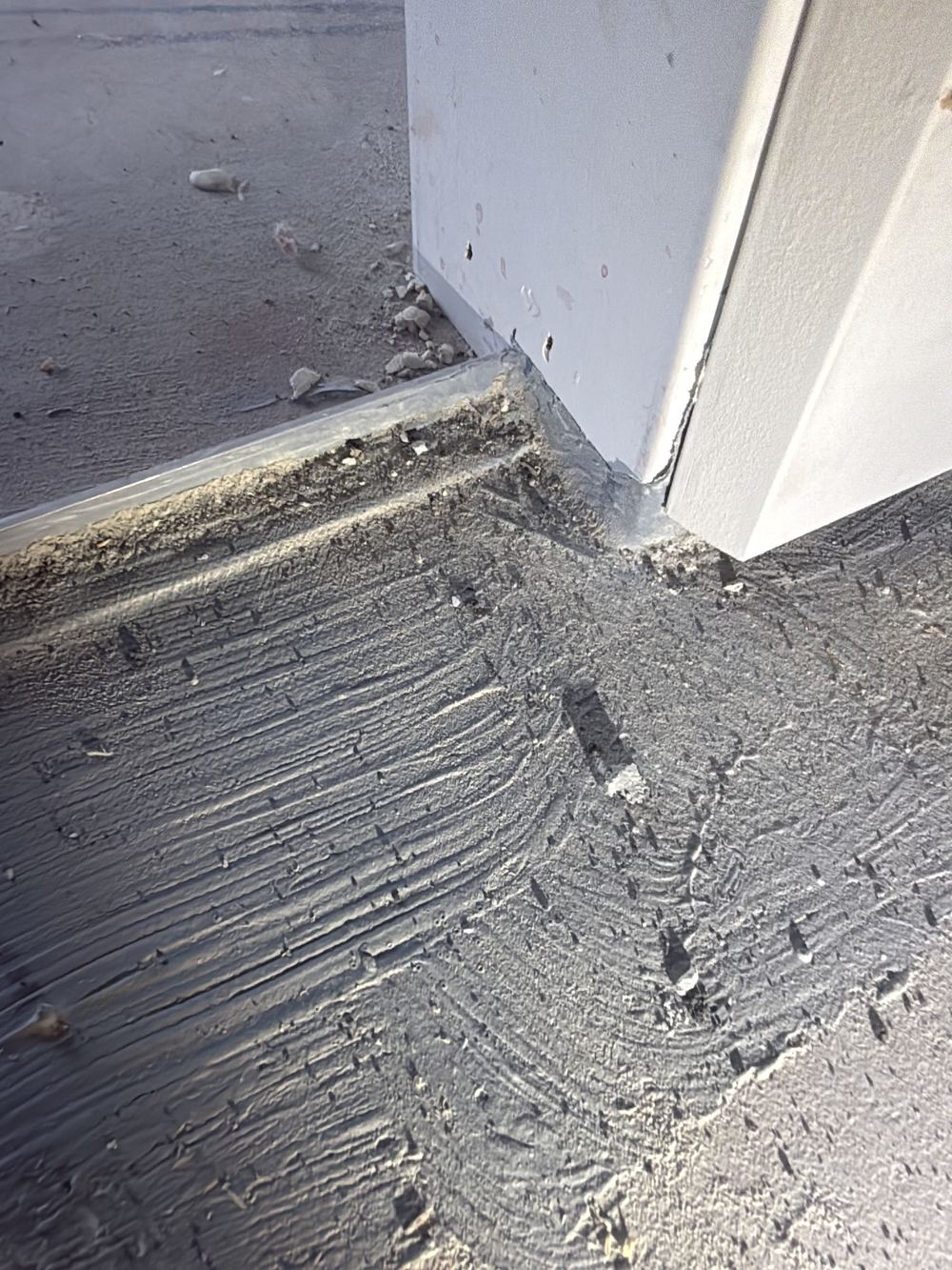 Door jamb sitting over the threshold without membrane carried behind it, found during a waterproofing inspection in Pakenham